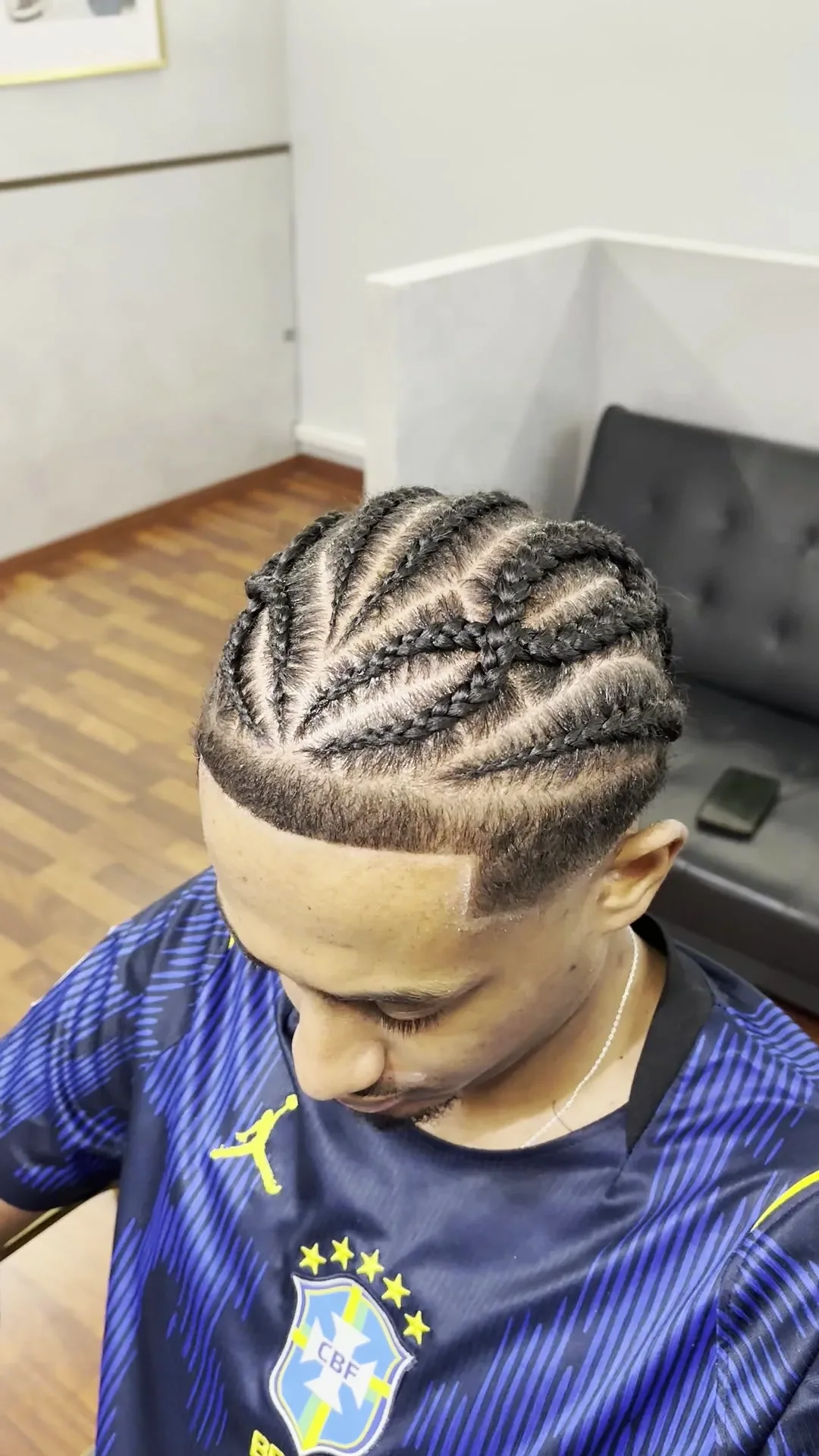 Cornrows with a geometric pattern, seen from above