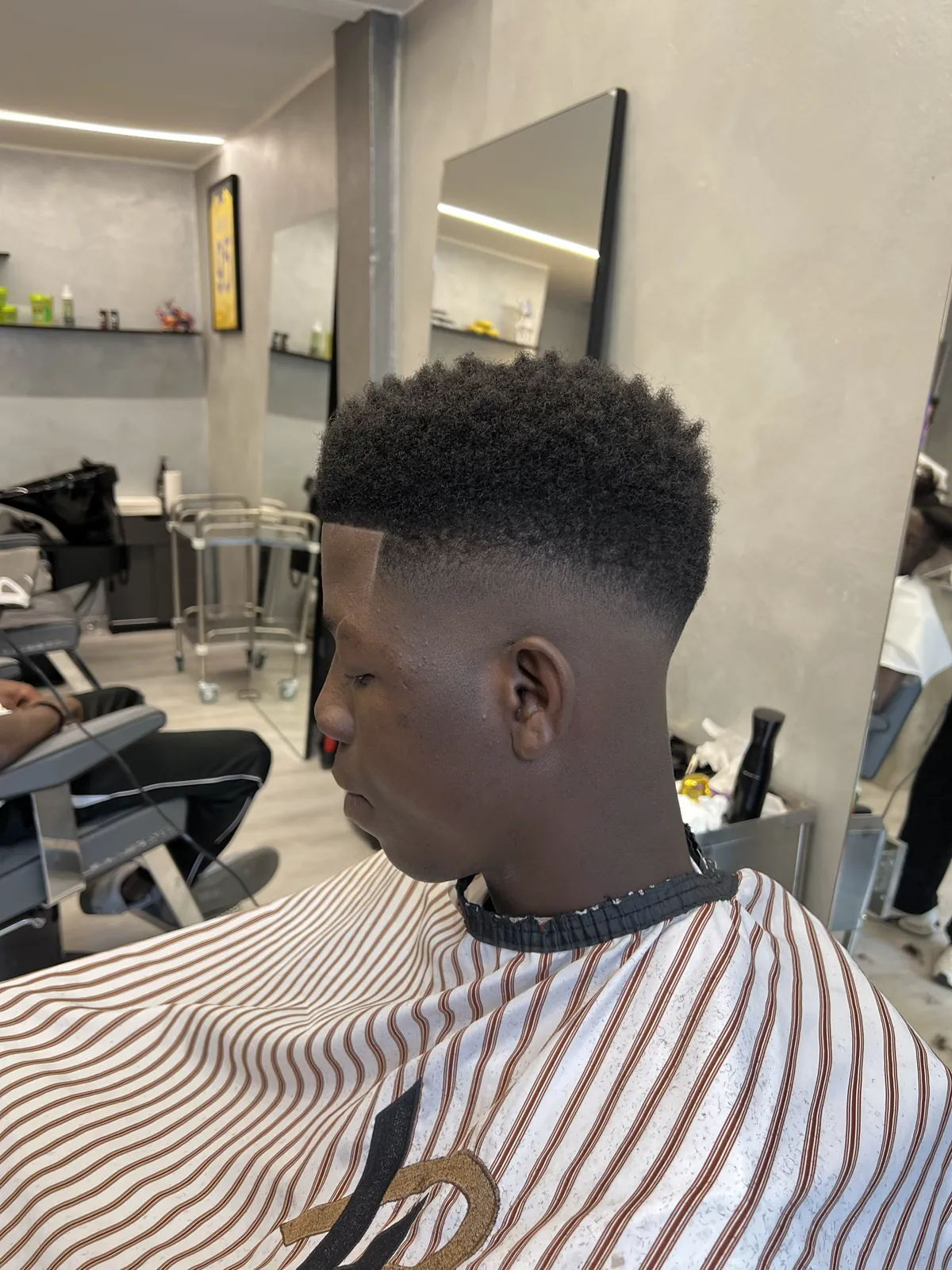 An afro with sharp outlines and a skin fade