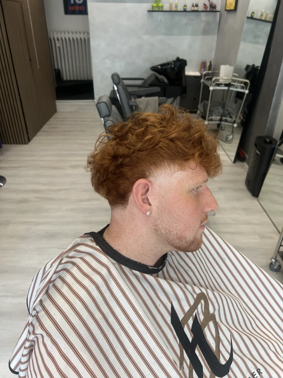 Copper curls with a soft taper on the sides